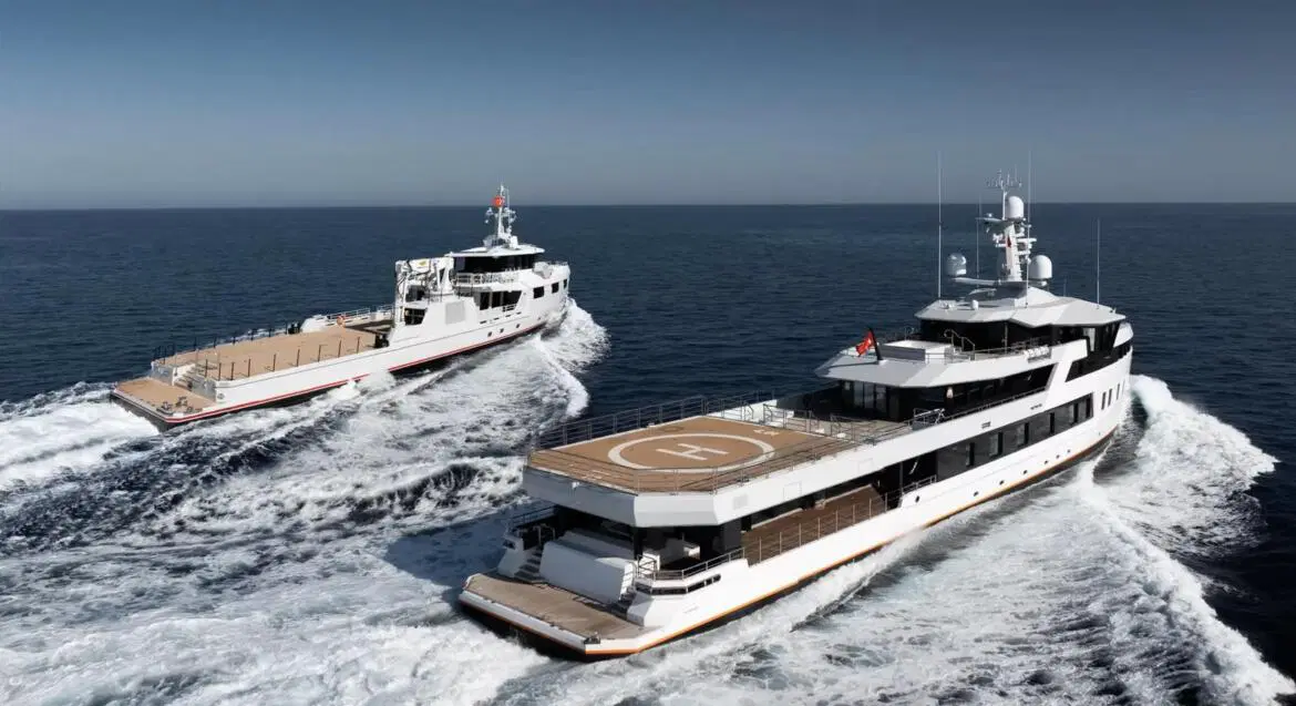 A secretive billionaire takes delivery of twin superyachts on the same day: a 197-foot Ice-class explorer and a 175-foot support vessel built for adventure over extravagance