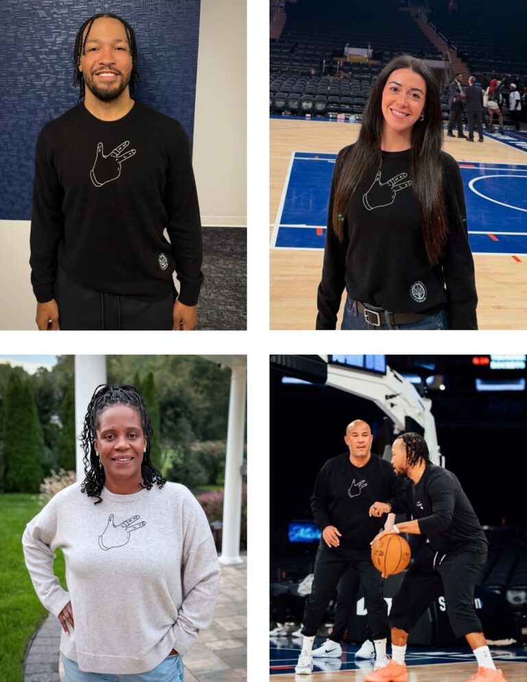 Four people wearing black and gray sweaters with a hand-gesture embroidery, photographed indoors and on a basketball court.