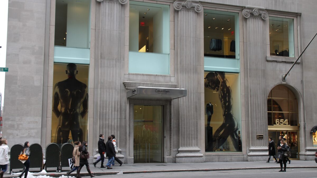 Exterior of the Calvin Klein Collection store at 654 Madison Avenue with pedestrians walking past.