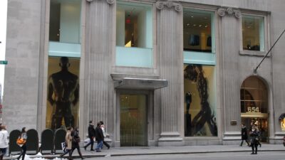 Exterior of the Calvin Klein Collection store at 654 Madison Avenue with pedestrians walking past.
